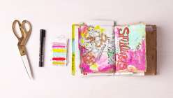 A colorful spread of pages in Dawn Sokol's art journal from her Holiday Art Journaling class on Creativebug.