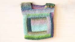 Join instructor Cirilia Rose and learn to make this baby sweater using a garter stitch square. You'll learn to add rows of garter strips and the pattern makes it easy to create the log cabin square. 