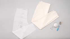 A pants muslin and a pants sloper plus sewing accessories.