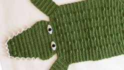  A green crocheted alligator rug  made in Twinkie Chan's Crochet a Wild Animal Rug class on Creativebug