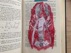 A book page example featuring a lobster traced on a transfer using a grease pencil, then collaged using security envelopes.