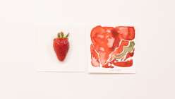 A strawberry and corresponding watercolor study from the Creativebug class Mixtape: Draw & Paint Summer Fruits class