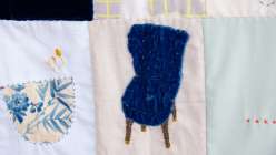 A quilt block featuring a blue embroidered velvet chair made by Heidi Parkes in her Love Letter Quilt Top: A Daily Practice class on Creativebug