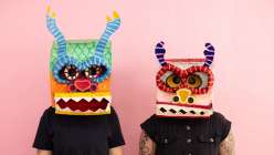 Two paper mache masks made by Katrina Wheeler in her Make a Paper Mache Dragon Head class on Creativebug