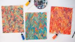Three sheets of marbled paper made in Mercedez Rex's Creativebug class