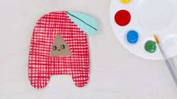A hand-painted letter A on a piece of upcycled cardboard from Suzy Altman's Creativebug class.