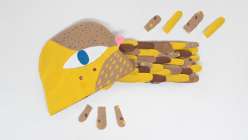 An in-progress painted paper bird costume made in Suzy Ultman's Sustainable Clay: Make a Bird Costume class on Creativebug.