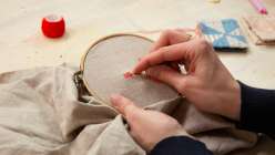 A pair of hands making darning stitches from Heidi Parkes's Hand Darning Techniques class on Creativebug