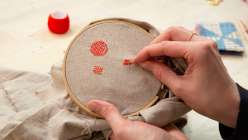 A pair of hands making darning stitches from Heidi Parkes's Hand Darning Techniques class on Creativebug