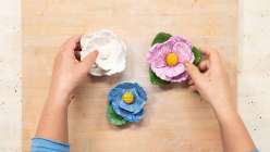 Three pretty hand-crafted flowers made by Cindy Willingham's in her Make a Peony with Air-Dry Clay class on Creativebug.