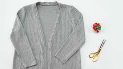 A grey mid-weight cardigan made in Sanae Ishida's Draft and Sew a Knit Cardigan class on Creativebug.
