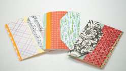 Three colorful handmade books made by Dawn M. Cardona in her Make a Mailable Art Book class on Creativebug.
