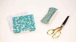 Fat quarters and handmade bias tape from Faith Hale's How to Make Continuous Bias Tape class on Creativebug.