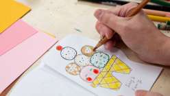 Suzy Ultman illustrating an abstracted ice cream cone family tree in her Sustainable Play: Make a Book About Me class on Creativebug.