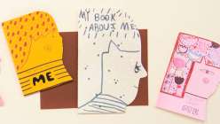 Three miniature paperback books in the shape of a face made by Suzy Ultman in her Creativebug class Sustainable Play: Make a Book About Me.