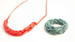 A red finger knit necklace and turquoise finger knit bracelet made in Faith Hale's Finger Knitting class on Creativebug.