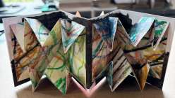 A folded Turkish Map Fold book made by e bond in her Creativebug Crafting Together live class.