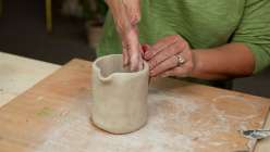 A clay vase being shaped by Cindy Willingham in her Hand-Built Vases with Air-Dry Clay class on Creativebug.