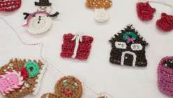 Multiple crocheted holiday motifs made by Twinkie Chan in her Holiday Crochet Applique class on Creativebug