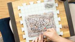 A colorful hand-knit sample being blocked by Liza Laird in her Yoga of Yarn: Brioche Knit Meditation Mat class on Creativebug