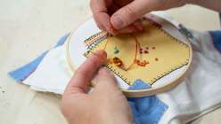 Rebecca Ringquist sewing a bullion stitch in her class on Creativebug