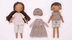 Two dolls made by Katia Ferris wearing clothes made in her Sew a Wardrobe for a 14-Inch Rag Doll class on Creativebug.