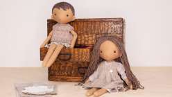 Two dolls made by Katia Ferris wearing clothes made in her Sew a Wardrobe for a 14-Inch Rag Doll class on Creativebug.