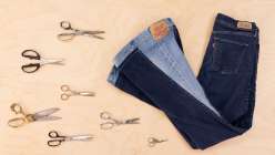 A pair of straight leg jeans upcycled into flare jeans by Sandra Lee Chandler in her Upcycled Denim: Side Seam Remix class on Creativebug.
