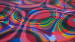 A close-up image of a piece of paper that wit two applications of marbling, made by Mercedez Rex in her Overmarbling On Paper class on Creativebug.