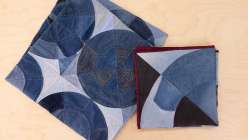 An overhead image of an Upcycled Denim Spinning Wheel Quilt made by Sandra Chandler in her class on Creativebug.