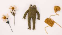 A crocheted frog toy made by Twinkie Chan in her Crochet a Posable Frog class on Creativebug