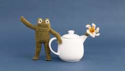 A crocheted frog toy made by Twinkie Chan in her Crochet a Posable Frog class on Creativebug