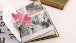An upcycled hardcover book featuring a Turkish map fold pop-up made by Sarah Matthews in her Upcycled Books: Make a Hardcover Journal class on Creativebug.