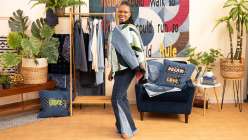 Sandra Chandler wearing a quilted jacket she made in her Upcycled Denim: Sew a Bomber Jacket class on Creativebug.