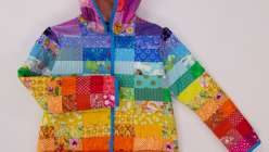 A vibrant, handcrafted jacket made by Taiga from House of Taiga in her Rainbow Gradient Quilted Coat class on Creativebug.
