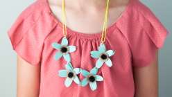 Annabel Wrigley shows you how to make this children's craft project. This kids summer crafts for kids project will teach you how to make a paper flower necklace using Cricut Explore.