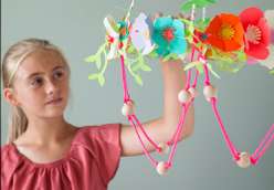 Annabel Wrigley teaches you with your child how to cut out flowers and vines using a Cricut Explore machine. Learn to make paper flowers in this children's crafting project.