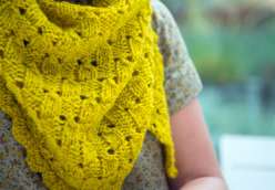 Fancy Tiger Crafts show you how to make a great knitting project with The Imposter’s Shawl. This hand made triangular shawl has basket weave stitches and scalloped edging appear to be woven and crocheted – but, in fact, it’s all cleverly knitted. 