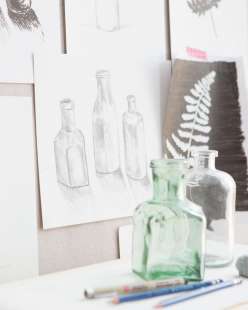 Use bottles and leaves as still life samples to draw and shade