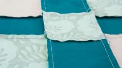 Learn how to chain piece fabric with modern quilter, Ashley Nickels and create a nine-patch quilt, how to piece them together row-by-row, how to sew your chained pieces together by nestling the seams