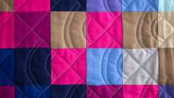 Ashley Nickels teaches you to design a pixelated jelly roll quilt top.  Learn to develop your quilting skills with a design wall, and then chain-piece the squares 